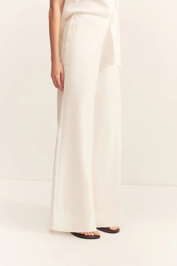 White wide-leg pants worn by a person on a white background