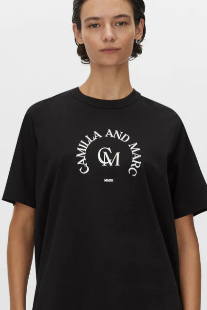 model in a Camilla and Marc Women's Black Logo Tee